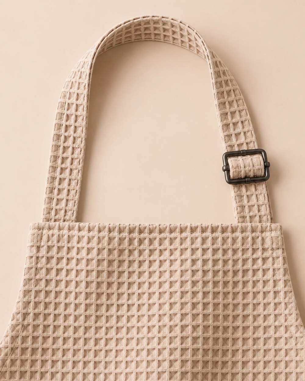 Close-up of the neck strap with its metal slider